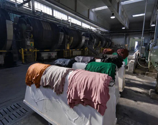Textiles on a conveyor belt in a factory setting