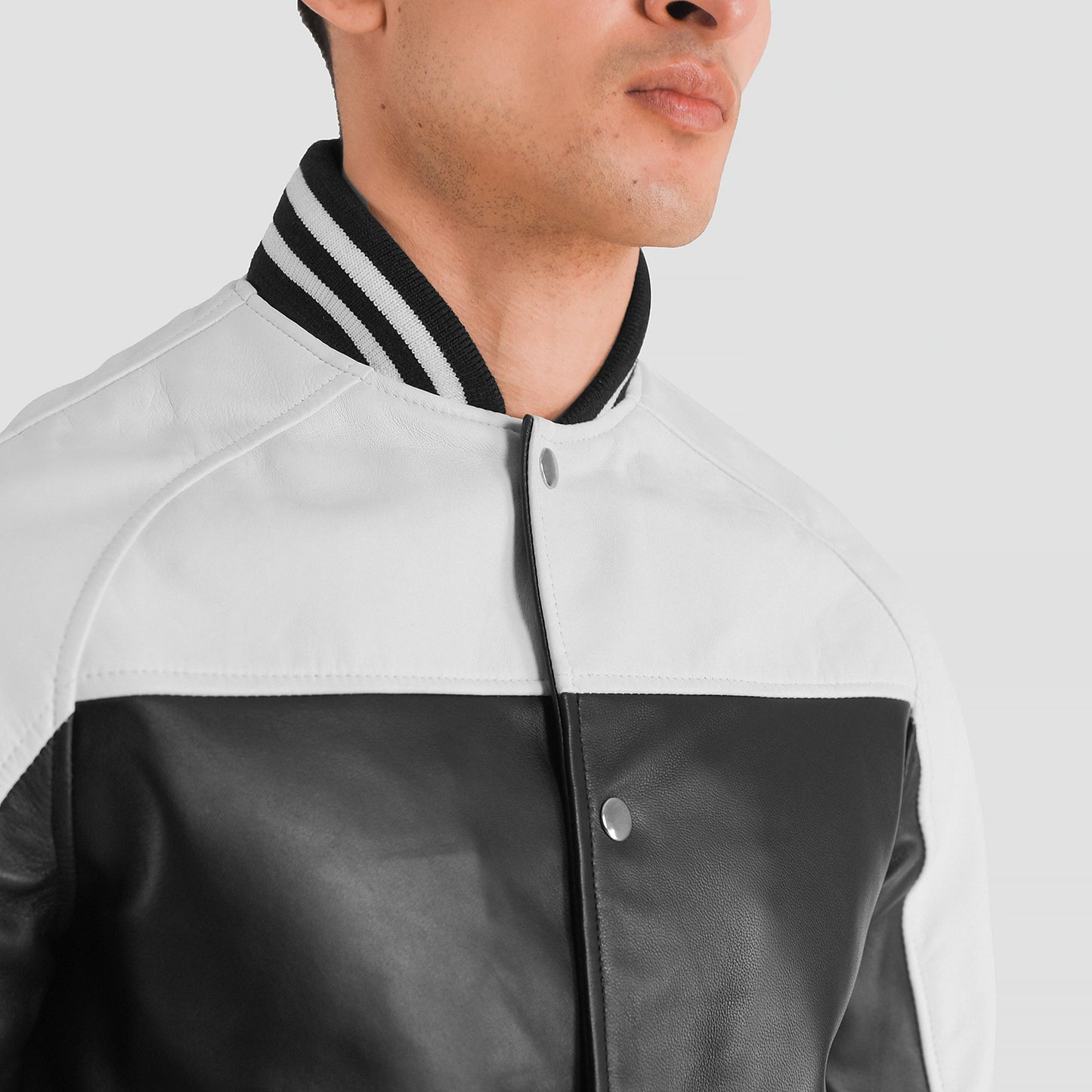black-and-white-leather-varsity-jacket-close-up-by-SKS-Wholesales