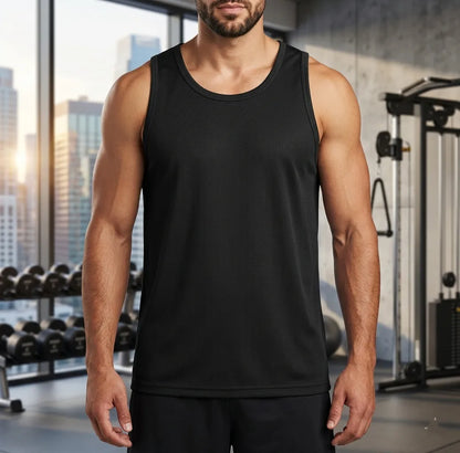 Man wearing a black tank top in a gym setting