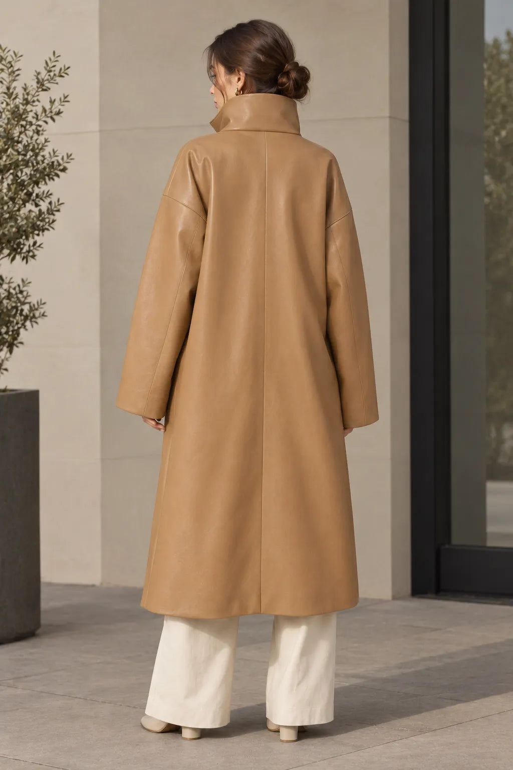 Women's camel oversized minimalist leather coat, clean funnel-neck front view