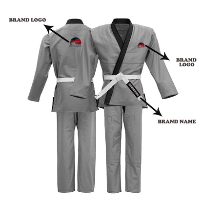 A grey BJJ GI with brand logo on the chest and brand name on the pants, featuring custom embroidery patches, a black belt, and reinforced stitching at stress points.