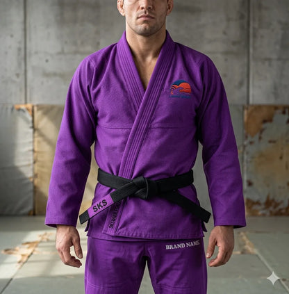 Person wearing a purple martial arts uniform with a brand logo in an indoor setting.
