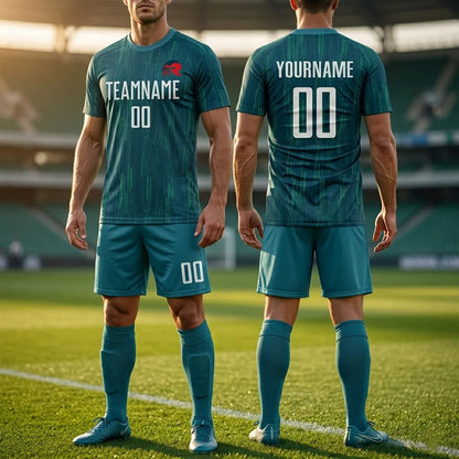 Two people wearing teal soccer jerseys with customizable text on a soccer field.